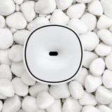 Mini Difusor USB SomniaRing sobre piedras
